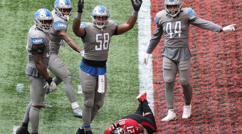 Lions linebacker Jamie Collins signals touchdown as Falcons running back Todd Gurley tries to stop short of the end zone to control the final minutes of the clock in October 2020 in Atlanta. Gurley broke the plane for a touchdown for a 20-16 lead, and the Falcons added the two-point conversion to extend the lead to 22-16. However, the Falcons left just enough time for the Lions to come back for the game-winning touchdown and extra point as time expired. (Curtis Compton / Curtis.Compton@ajc.com)