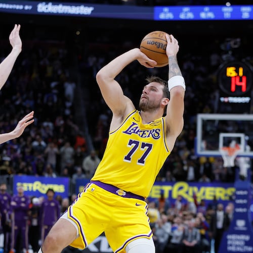 Los Angeles Lakers guard Luka Doncic (77) looks to make a shot-attempt in the fourth quarter of a loss to the Detroit Pistons in an NBA basketball game Monday, March 23, 2026, in Detroit. (AP Photo/Duane Burleson)