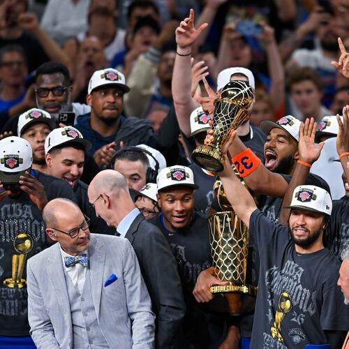 New York Knicks guard Jalen Brunson holds the MVP trophy after the Knicks defeated the San Antonio Spurs in Game 5 of the NBA Finals basketball series, Saturday, June 13, 2026, in San Antonio. (AP Photo/Darren Abate)