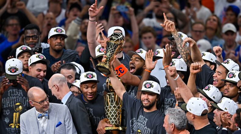 New York Knicks guard Jalen Brunson holds the MVP trophy after the Knicks defeated the San Antonio Spurs in Game 5 of the NBA Finals basketball series, Saturday, June 13, 2026, in San Antonio. (AP Photo/Darren Abate)