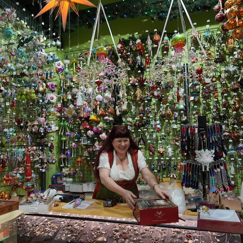 Owner of the Christel Dauwe Collection ornaments shop, Christel Dauwe, wraps boxes of holiday ornaments at her shop in Antwerp, Belgium, Monday, Dec. 8, 2025. (AP Photo/Virginia Mayo)