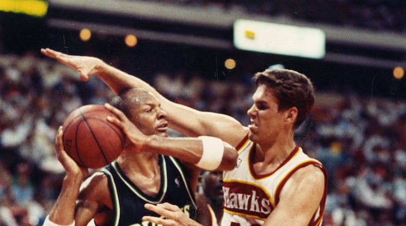 Jon Koncak of the Hawks defends against Terry Cummings during the playoffs in 1989. William Berry / AJC file photo