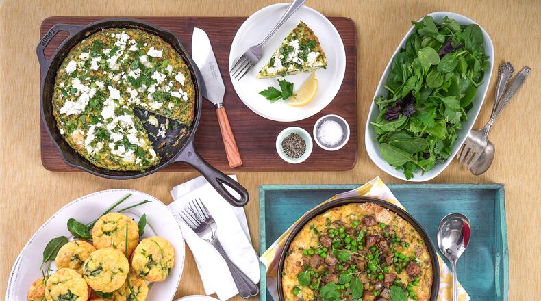 Frittatas are relaxed, throw-together egg dishes cooked and baked in ovenproof skillets. Adding flour, baking powder and full-fat Greek yogurt transforms frittatas, like this Springy Herb Frittata (top center), Potato & Pea Frittata (bottom right) and Florentine Frittata Muffins (bottom left), into magical meals. (Chadwick Boyd for The Atlanta Journal-Constitution)