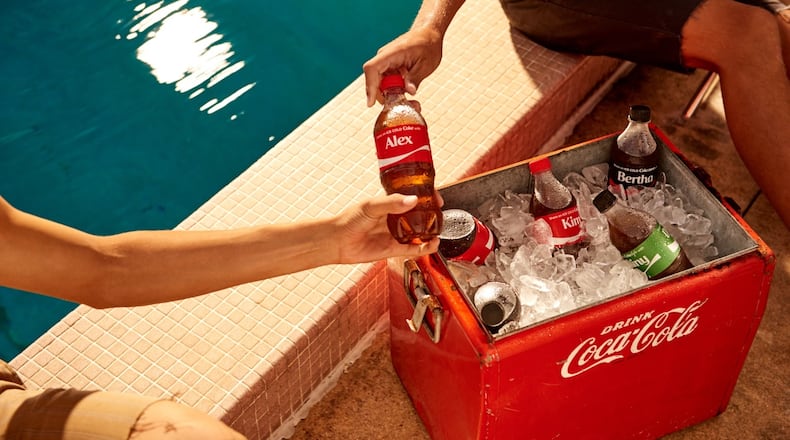 Coca-Cola said it is bringing back personalized pop bottles for a summer marketing campaign with last names and first names this year. Photo: Coca-Cola.