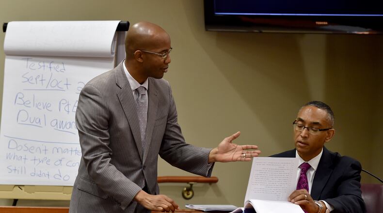 District Attorney Robert James asks DeKalb County CEO Burrell Ellis to review prior testimony Tuesday. Ellis faces charges that he threatened companies that resisted donating to his 2012 re-election campaign. BRANT SANDERLIN/BSANDERLIN@AJC.COM
