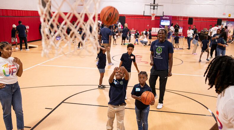 Students from the Boyce Ansley School downtown had their first field trip to Marietta where a day of sporting activities ended with each child receiving a laptop. Courtesy of Tim Harman
