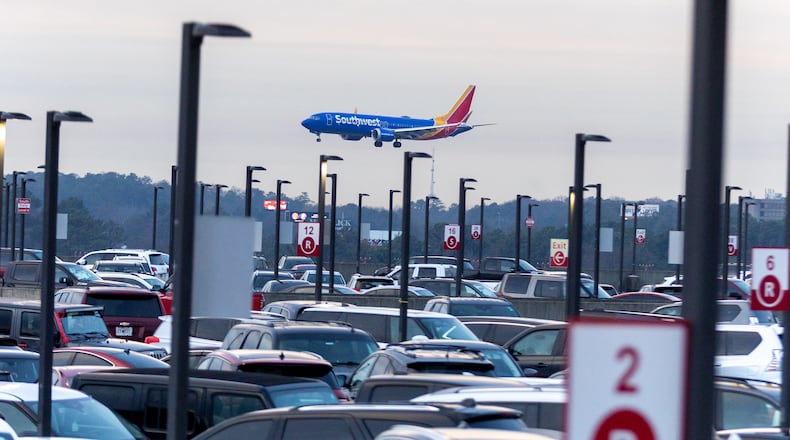 A Southwest Airlines plane lands near Terminal South parking at Hartsfield-Jackson Atlanta International Airport on Friday, December 22, 2023. (Steve Schaefer/steve.schaefer@ajc.com)