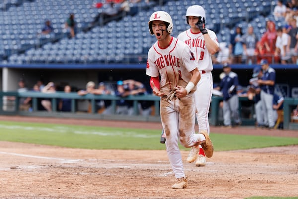 Loganville second baseman Brantley Carter celebrates after scoring on a sacrifice fly by pitcher Jake Boland during Game 1 of the GHSA Class 5A championship series at Gwinnett Field on Monday, May 25, 2026, in Lawrenceville. (Estela Muñoz/AJC)