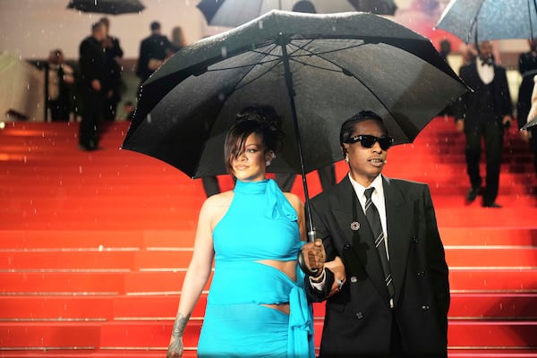 Rihanna, left, and A$AP Rocky pose for photographers upon departure from the premiere of the film 'Highest 2 Lowest' at the 78th international film festival, Cannes, southern France, Monday, May 19, 2025. (Photo by Lewis Joly/Invision/AP)