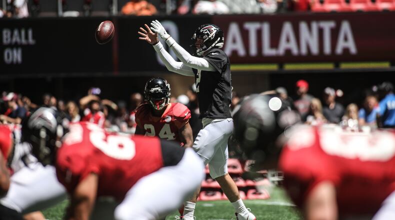 Atlanta Falcons quarterback Matt Ryan (2) takes a snap during open practice Sunday, July 29, 2018, at Mercedes-Benz Stadium in Atlanta.