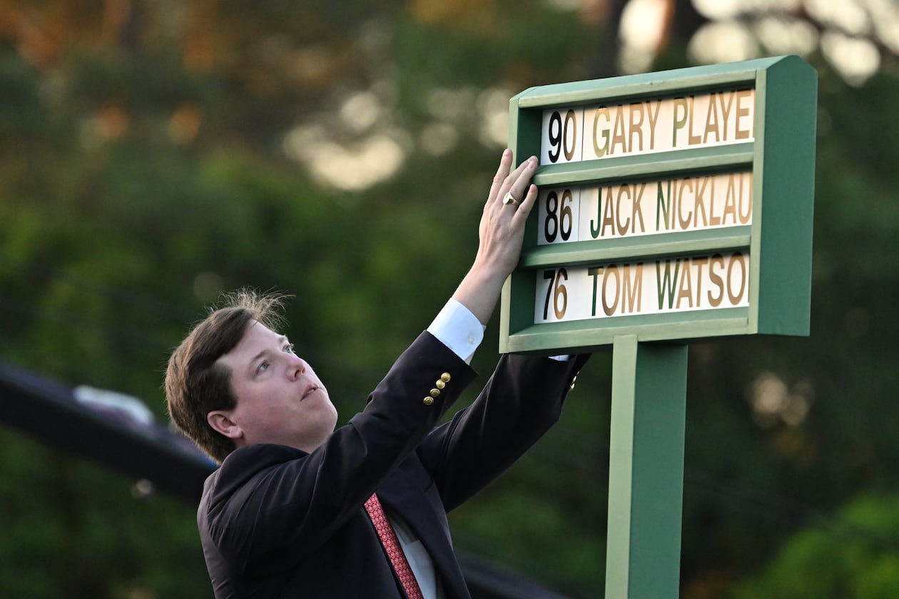 The board showing the honorary starters of 2026 Masters is updated by a person, not technology. (Hyosub Shin/AJC)