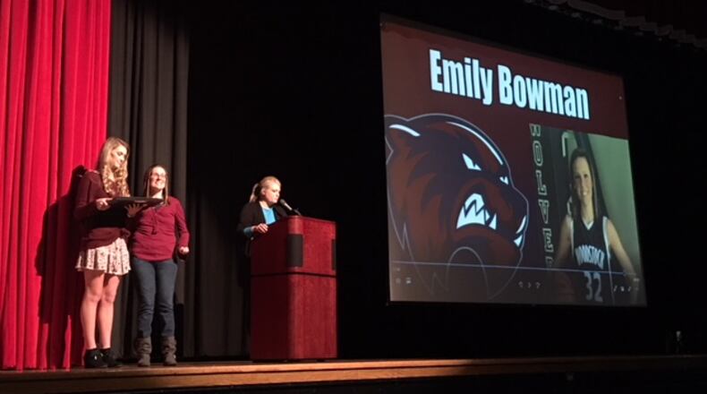 Crash survivor Emily Bowman receives a Woodstock High athlete alumnus award in front of several hundred female high school athletes at Cherokee High School on Feb. 5. Doug Turnbull/WSB Radio