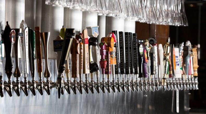 A pending ordinance amendment in Alpharetta would allow limited sales and consumption of beer and wine in downtown district parks. AJC FILE