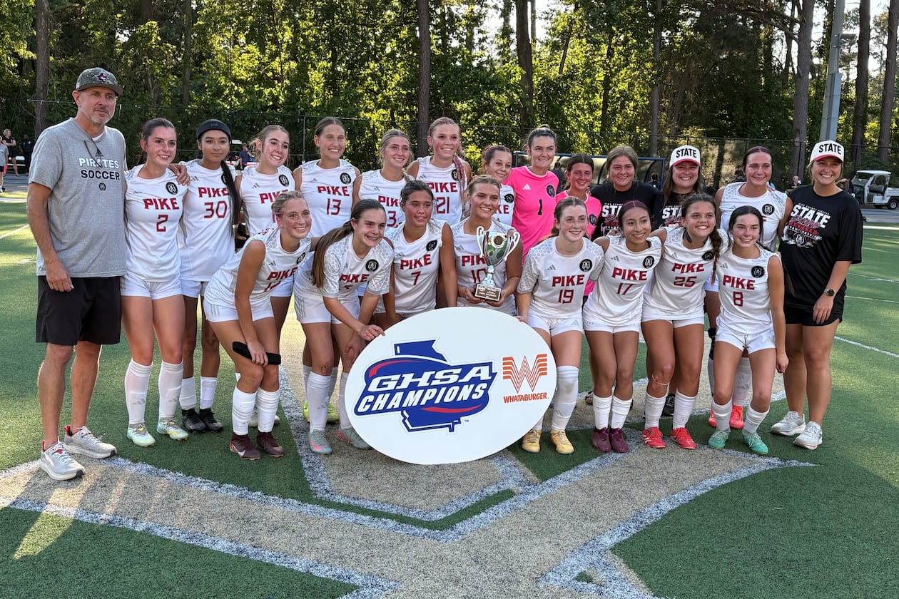 Pike County players and coaches celebrate after winning their second consecutive Class 2A girls soccer championship on May 13, 2026, at St. Pius X High School in Atlanta. (Chip Saye/AJC)