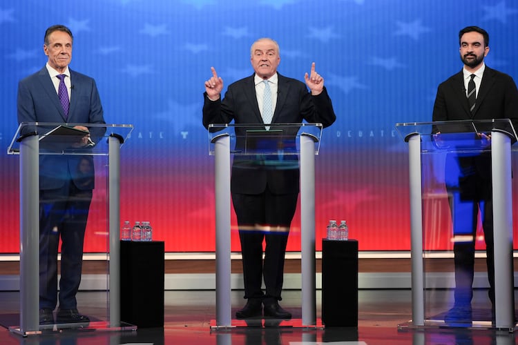 Republican candidate Curtis Sliwa, center, speaks during a mayoral debate with independent candidate former New York Gov. Andrew Cuomo, left, and Democratic candidate Zohran Mamdani, Thursday, Oct. 16, 2025, in New York. (AP Photo/Angelina Katsanis, Pool)
