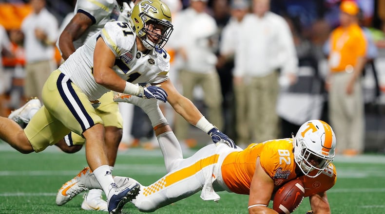 ATLANTA, GA - SEPTEMBER 04:  Ethan Wolf #82 of the Tennessee Volunteers fails to pull in this reception against Brant Mitchell #51 of the Georgia Tech Yellow Jackets at Mercedes-Benz Stadium on September 4, 2017 in Atlanta, Georgia.  (Photo by Kevin C. Cox/Getty Images)