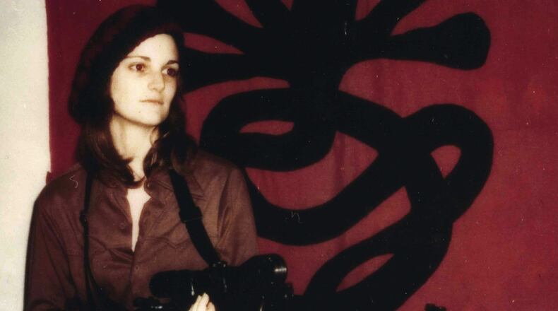 This Polaroid portrait of Patty Hearst, staged and styled by her captors, the so-called Symbionese Liberation Army, has her posed with a machine gun in front of the group’s seven-headed cobra. Photo: courtesy Doubleday