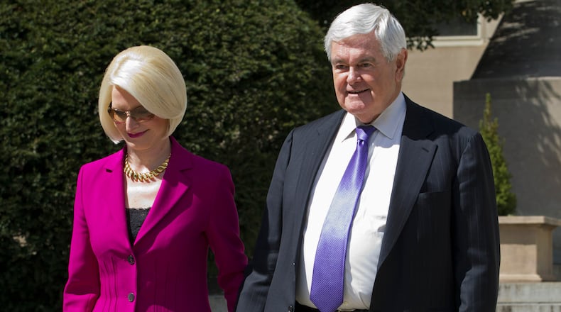 Former House Speaker Newt Gingrich and his wife Callista leave a closed-door meeting with Republican presidential candidate Donald Trump in Washington, Monday, March 21, 2016. (AP Photo/Jose Luis Magana)
