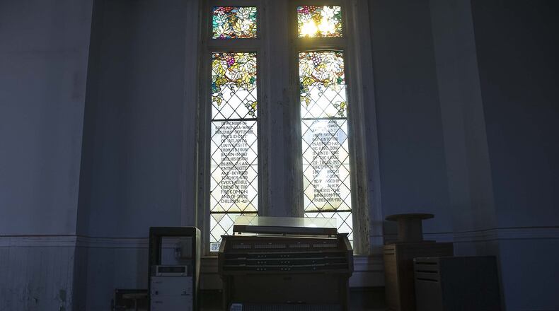 12/05/2019 — Atlanta, Georgia — Sunlight peers through a stained glass window in the abandoned chapel space at Fountain Hall on the campus of Morris Brown College, Thursday, December 5, 2019. (ALYSSA POINTER/ALYSSA.POINTER@AJC.COM)