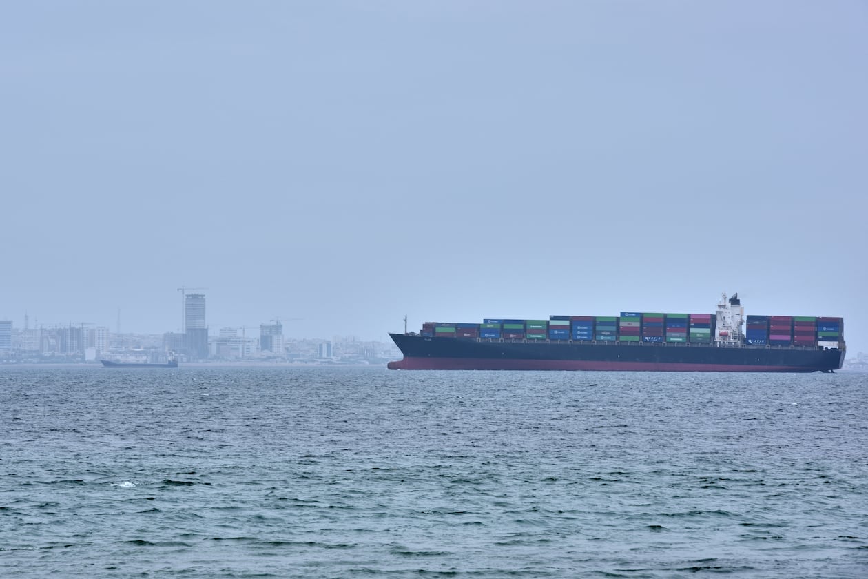 A container ship is seen in the Strait of Hormuz off the coast of Qeshm Island, Iran, Saturday, April 18, 2026. (AP Photo/Asghar Besharati)