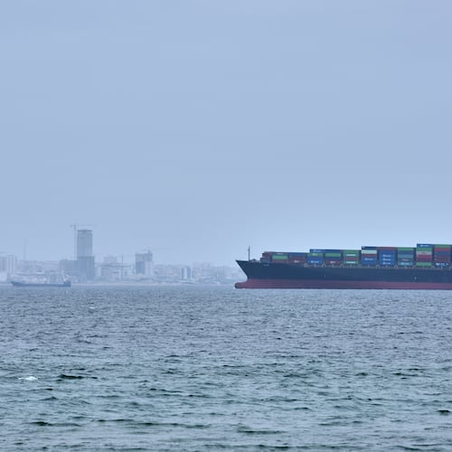 A container ship is seen in the Strait of Hormuz off the coast of Qeshm Island, Iran, Saturday, April 18, 2026. (AP Photo/Asghar Besharati)