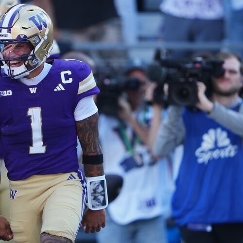 Washington quarterback Demond Williams Jr. celebrates scoring a touchdown against Washington State during the first half of an NCAA college football game, Sunday, Sept. 6, 2026, in Seattle. (AP Photo/Lindsey Wasson)