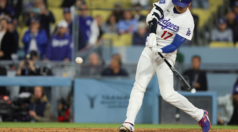 Los Angeles Dodgers designated hitter Shohei Ohtani hits an RBI ground-rule double to score Andy Pages during the ninth inning of a baseball game against the Miami Marlins Monday, April 27, 2026, in Los Angeles. (AP Photo/Ryan Sun)