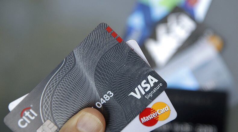 With fewer cash transactions and more electronic ones, more and more poeple are vulnerable to cyber hacks. (AP Photo/Elise Amendola)