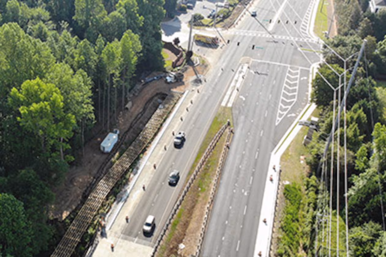An aerial image of a stretch of Pleasant Hill Road through Duluth. Portman Holdings is pursuing plans to turn nearly 112 acres of forested land in Duluth into a mixed-use community. (Courtesy Gwinnett County via Dji)