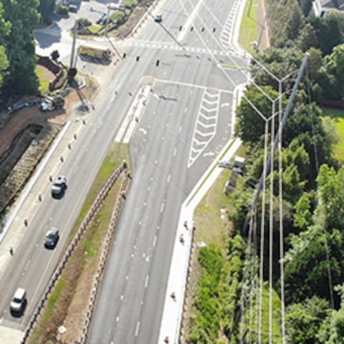An aerial image of a stretch of Pleasant Hill Road through Duluth. Portman Holdings is pursuing plans to turn nearly 112 acres of forested land in Duluth into a mixed-use community. (Courtesy Gwinnett County via Dji)