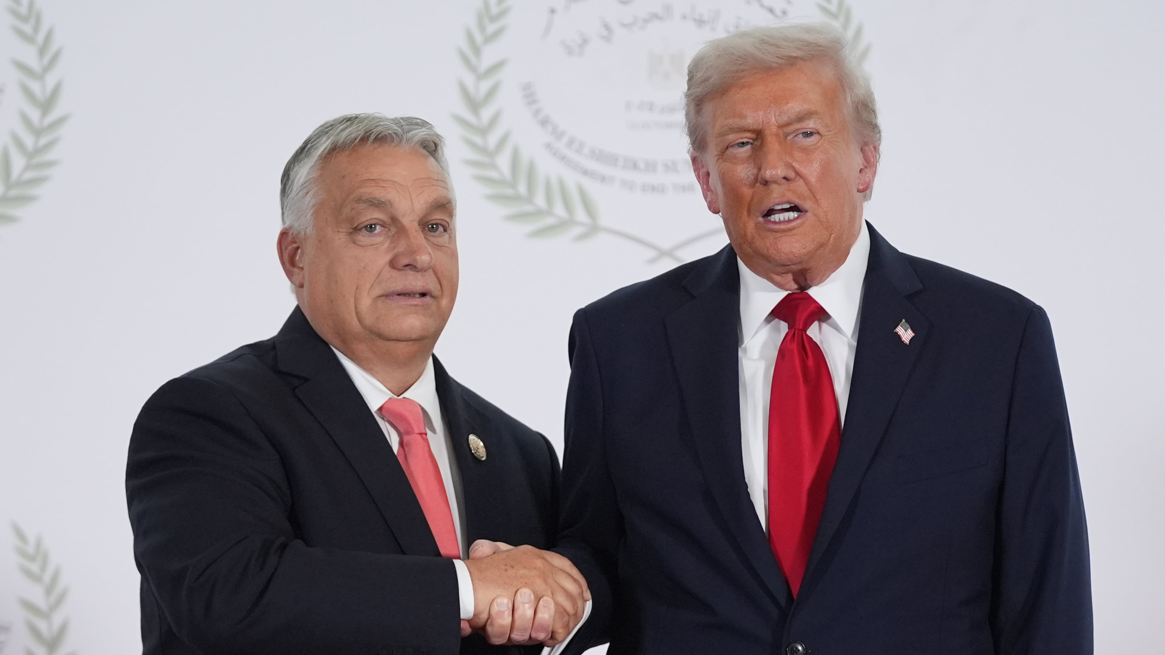 President Donald Trump greets Hungary's Prime Minister Viktor Orban during a summit to support ending the more than two-year Israel-Hamas war in Gaza after a breakthrough ceasefire deal, Monday, Oct. 13, 2025, in Sharm El Sheikh, Egypt. (AP Photo/Evan Vucci, Pool)