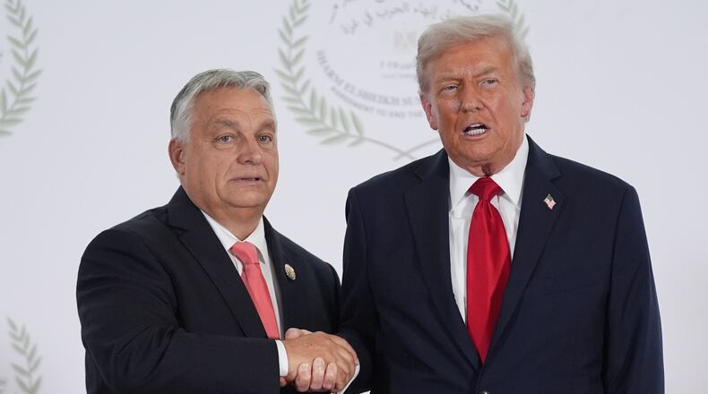President Donald Trump greets Hungary's Prime Minister Viktor Orban during a summit to support ending the more than two-year Israel-Hamas war in Gaza after a breakthrough ceasefire deal, Monday, Oct. 13, 2025, in Sharm El Sheikh, Egypt. (AP Photo/Evan Vucci, Pool)