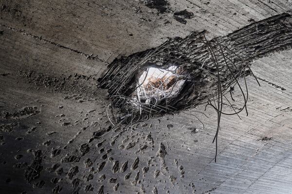 The impact of an explosion is visible on the roof of a hangar following an Israeli strike on a military airbase near Hama, Syria, Thursday, April 3, 2025. (AP Photo/Omar Albam)