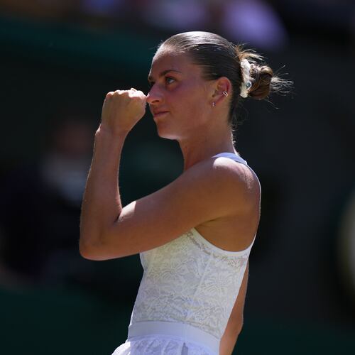 Marta Kostyuk of Ukraine celebrates a point against Jasmine Paolini of Italy, in their quarter-final women's singles match at the Wimbledon Tennis Championships in London, Wednesday, July 8, 2026. (AP Photo/Brian Inganga)