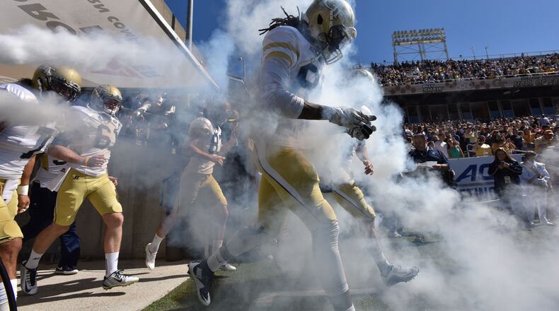 Georgia Tech Yellow Jackets players run on to the field before their game against the Pittsburgh Panthers at Bobby Dodd Stadium on Saturday, October 17, 2015. HYOSUB SHIN / HSHIN@AJC.COM