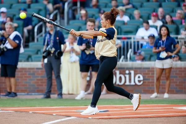 Elle Duncan, then an ESPN Sports anchor, hits the ball during the MLB All-Star Celebrity Game at Truist Park in 2025. (Miguel Martinez/ AJC)