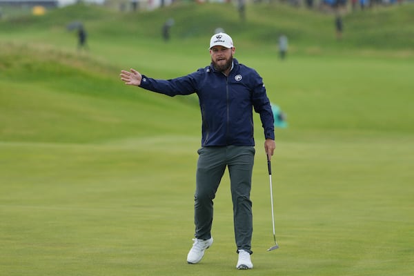 Tyrrell Hatton of England gestures after putting on the 10th green during the first round of the British Open golf championship at the Royal Portrush Golf Club, Northern Ireland, Thursday, July 17, 2025. (AP Photo/Jon Super)