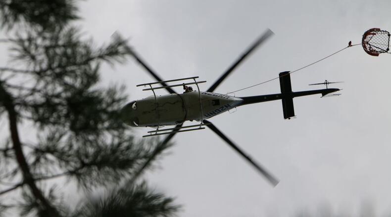 A helicopter helps with rescue efforts at Tallulah Gorge in northeast Georgia.