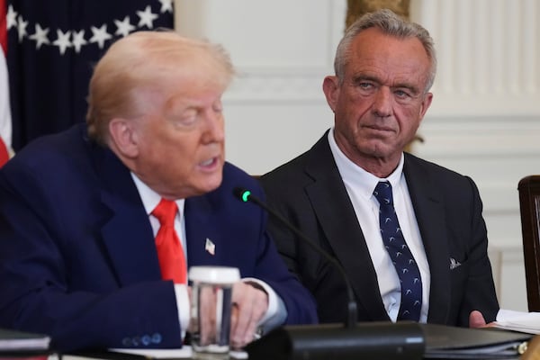 Health and Human Services Secretary Robert F. Kennedy Jr. (right) listened as President Donald Trump spoke about health care last month at the White House.