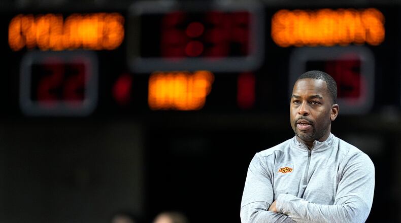 FILE - Oklahoma State head coach Mike Boynton watches from the bench during the first half of an NCAA college basketball game against Iowa State, Jan. 13, 2024, in Ames, Iowa. (AP Photo/Charlie Neibergall, File)