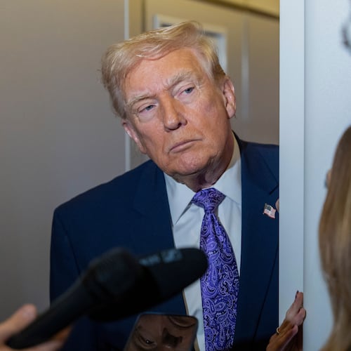 President Donald Trump speaks with reporters while in flight on Air Force One from his Mar-a-Lago estate in Palm Beach, Fla., to Joint Base Andrews, Sunday, Nov. 30, 2025. (AP Photo/Alex Brandon)