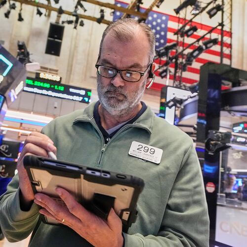Trader William Lawrence works on the floor of the New York Stock Exchange, Monday, Jan. 26, 2026. (AP Photo/Richard Drew)