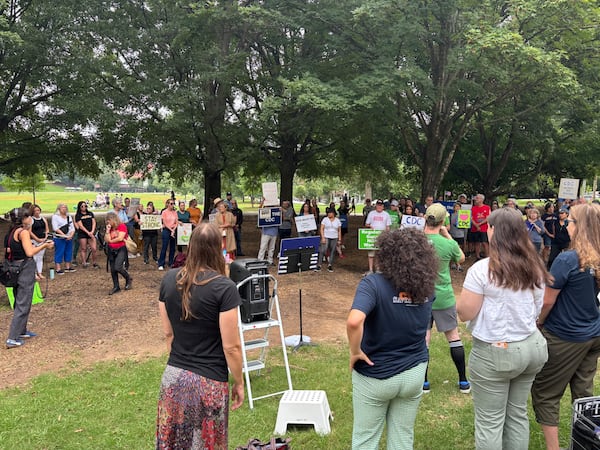 More than 50 people attend the rally in Atlanta's Piedmont Park on Sunday, Aug. 10, 2025, two days after a gunman opened fire at the Centers for Disease Control and Prevention. (David Aaro/AJC)