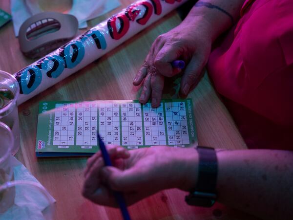 Players fill out their bingo cards during Bingo Loco at Believe Music Hall in Atlanta on Saturday, July 18, 2026. (Olivia Bowdoin for the AJC)