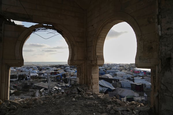 A makeshift tent camp for displaced Palestinians stretches across the port of Gaza City on Thursday, May 22, 2025. (AP Photo/Jehad Alshrafi)