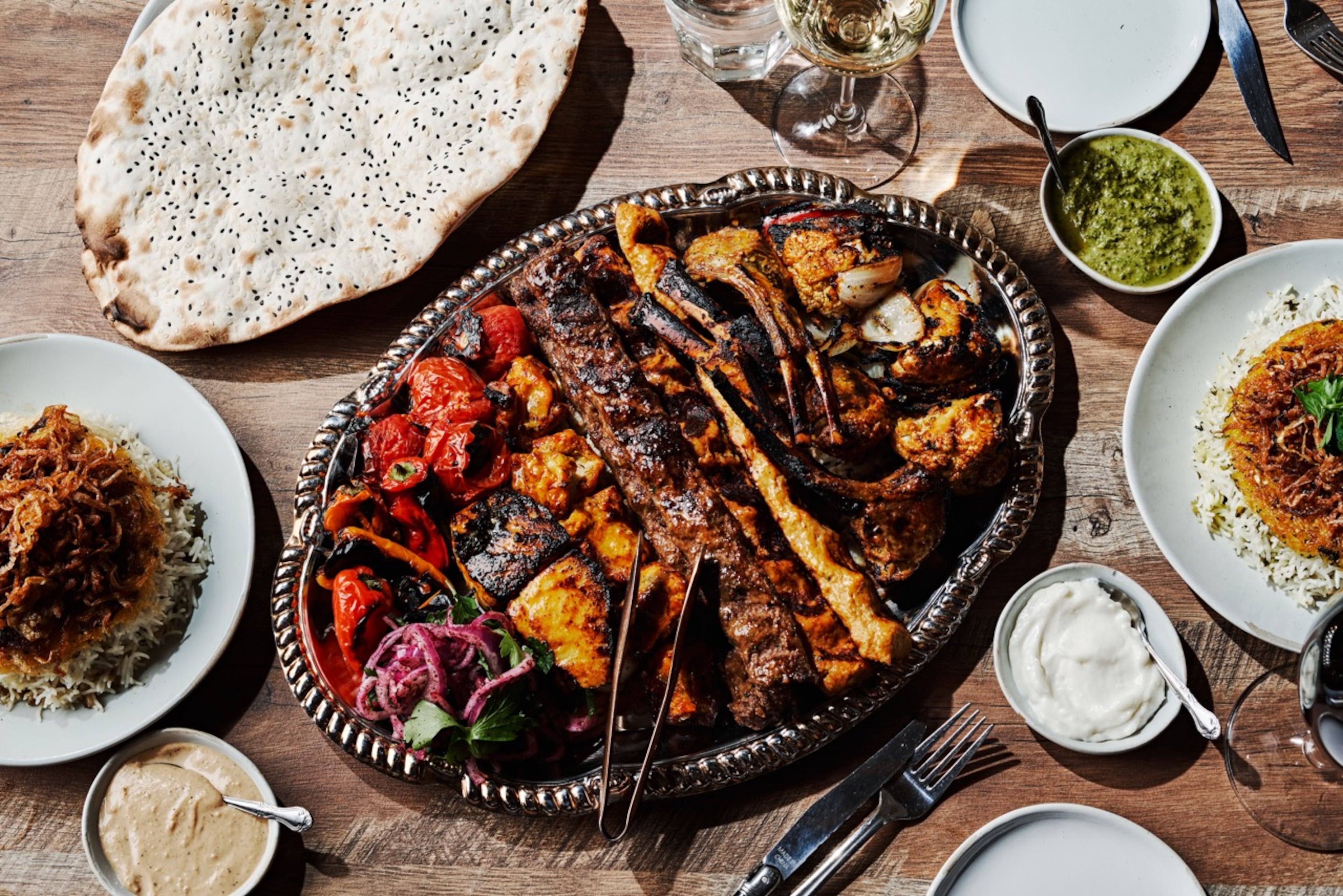 The kitchen at Delbar is not shy about using its Middle Eastern herbs and spices, including on this kabob platter with accoutrements. (Andrew Thomas Lee/Delbar)