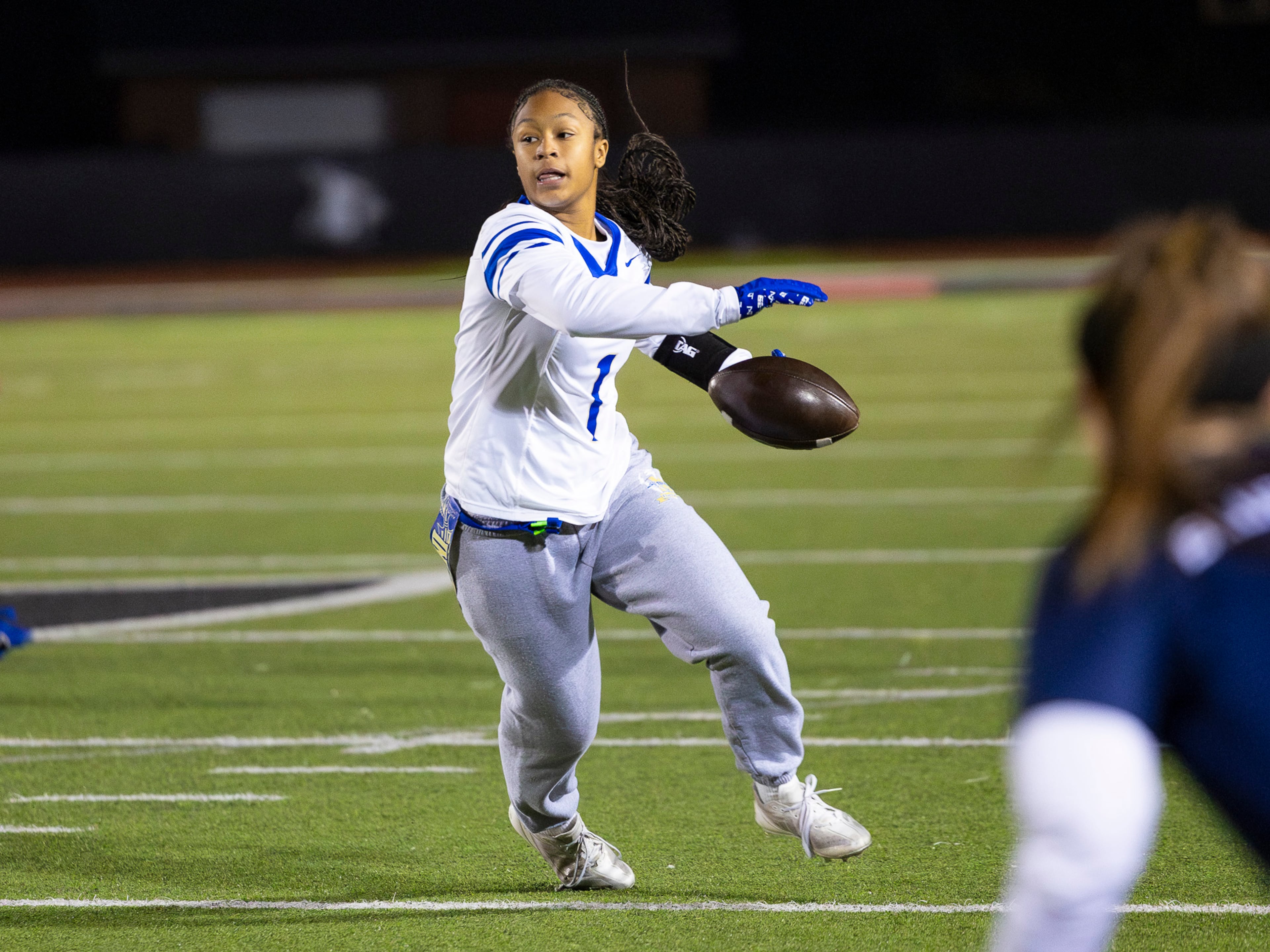 McEachern wide receiver Michala Butler (1) gets her flag pulled in a flag football game against McEachern at Osborne High School in Marietta, GA on Monday, November 17th, 2025. (Oscar Guevara Saenz for the AJC)