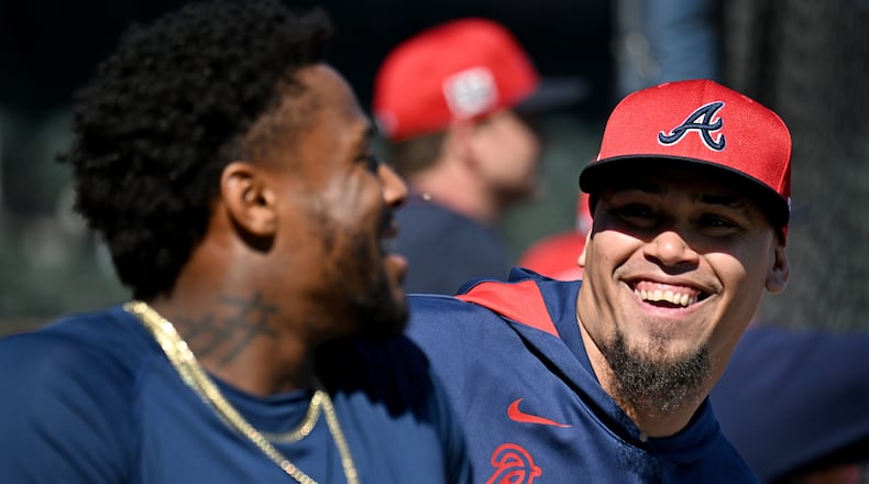 Atlanta Braves outfielder Ronald Acuna Jr. plays with shortstop Orlando Arcia (right) during spring training workouts at CoolToday Park, Monday, February 17, 2025, North Port, Florida. (Hyosub Shin / AJC)