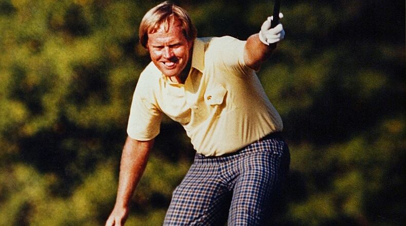 Jack Nicklaus takes pleasure in watching his putt drop for a birdie on the 17th hole at Augusta National on April 13, 1986.