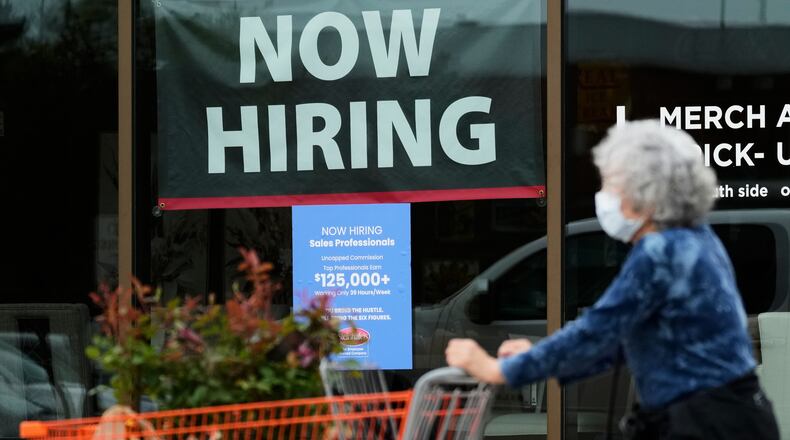 FILE - Hiring sign for sales professionals is displayed at a store, in Vernon Hills, Ill., Wednesday, April 15, 2026. (AP Photo/Nam Y. Huh, file)